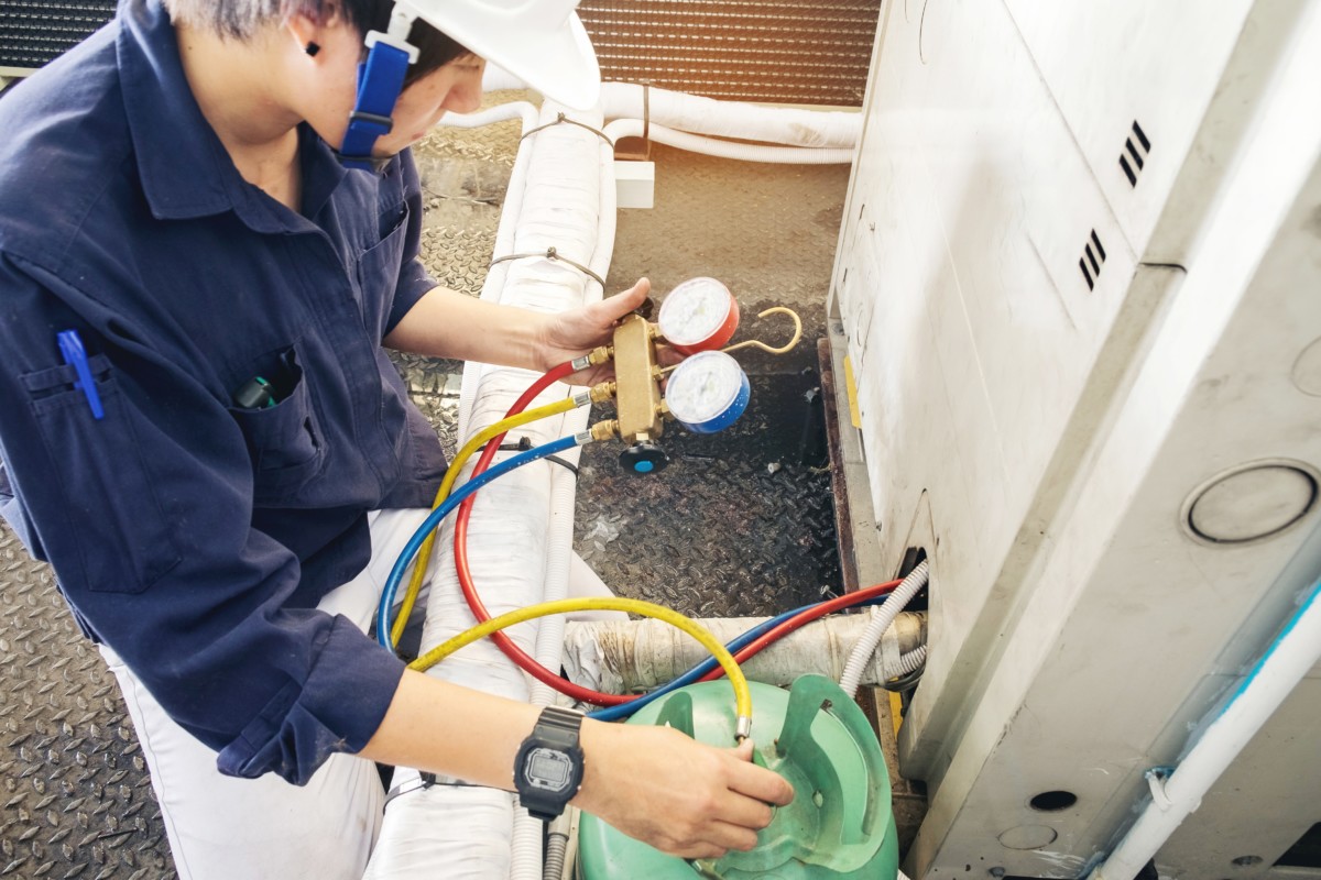 Technician is checking air conditioner